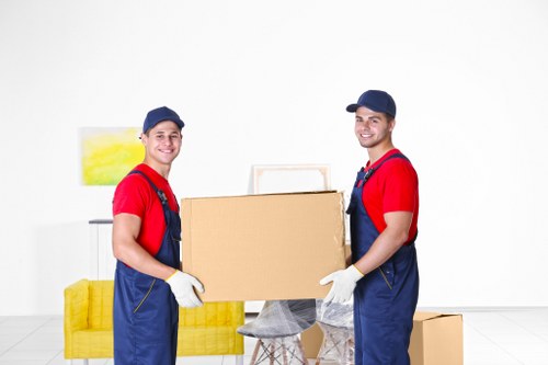 Local moving team organising boxes for a Rayners Lane property