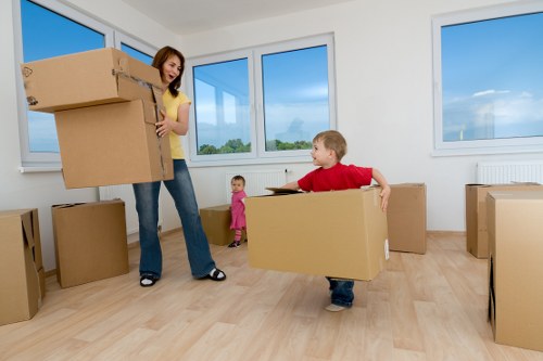 Organised commercial relocation boxes and furniture ready for transport in Rayners Lane