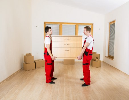 Packed boxes and furniture prepared for a house move in Rayners Lane